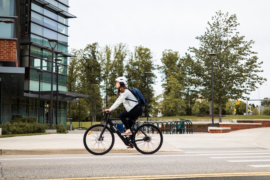 Woman riding a bike in a town